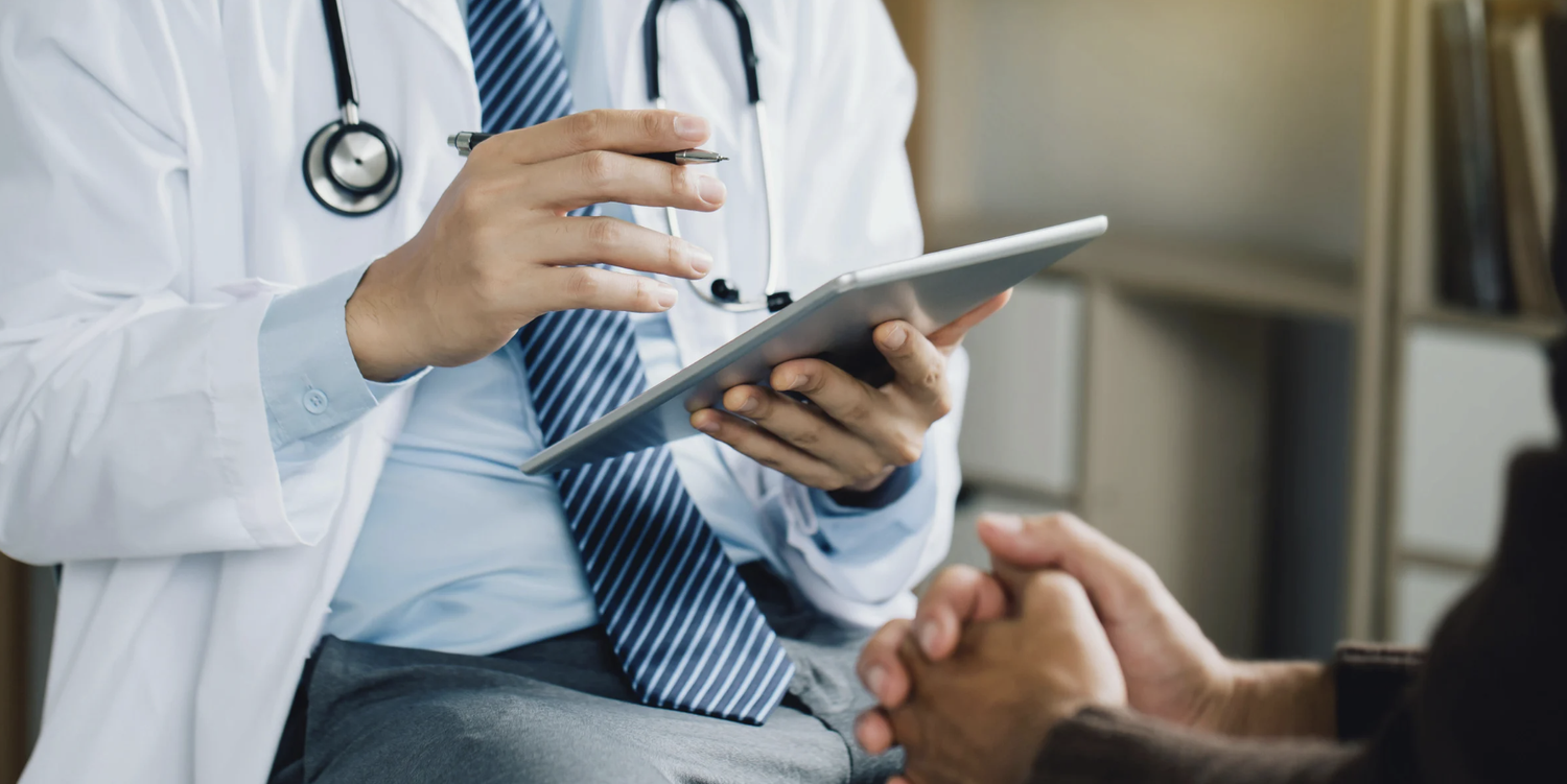 Primary care provider reviewing a chart with a patient